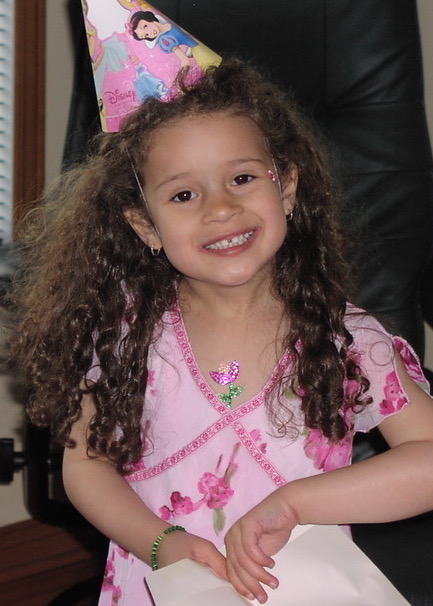 A young Audray wearing a pink flowery dress